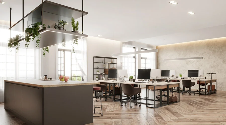 Ambiente coworking con isola cucina attrezzata